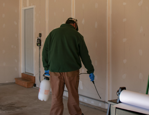 PestShield technician spraying a garage